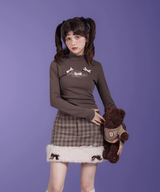 ハーフネックスリムリボントップス