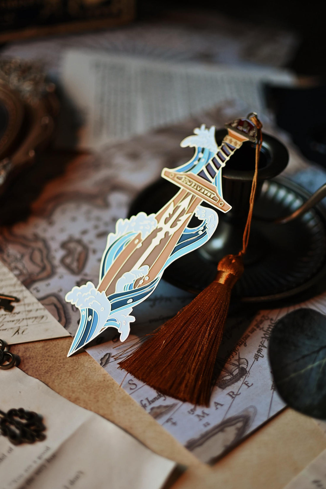 Percy Jackson inspired enamel pin featuring Percy's sword riptipe surounded by ocean waves.
