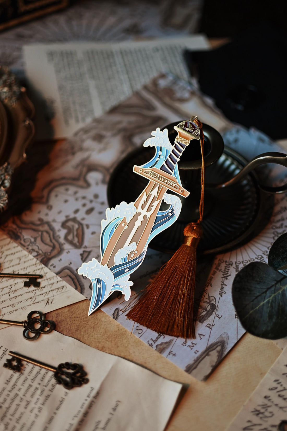Percy Jackson inspired enamel pin featuring Percy's sword riptipe surounded by ocean waves.