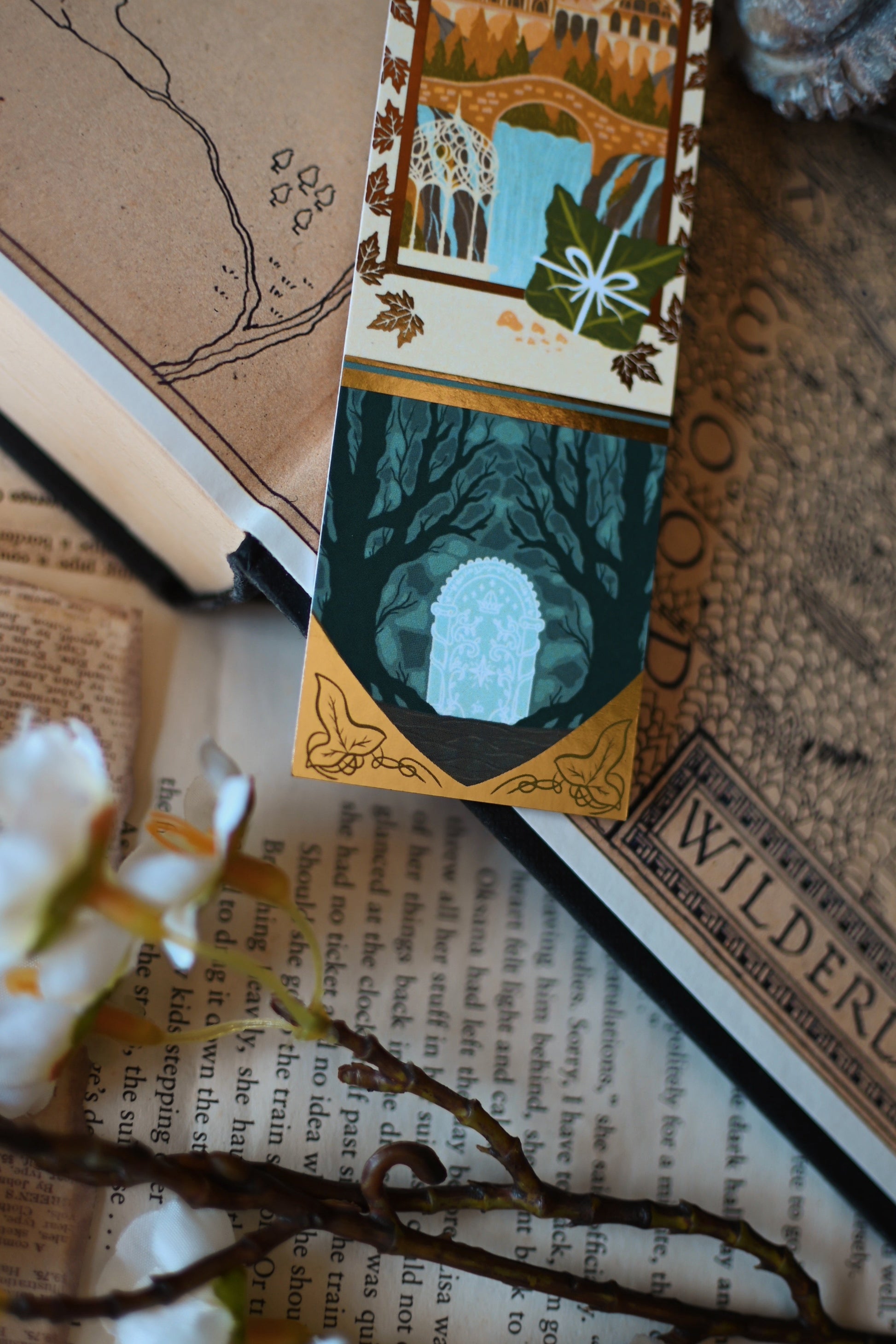 A close up of The Fellowship of the Ring bookmark showcasing the doorway to the mines of Moria alright and some lambas bread.